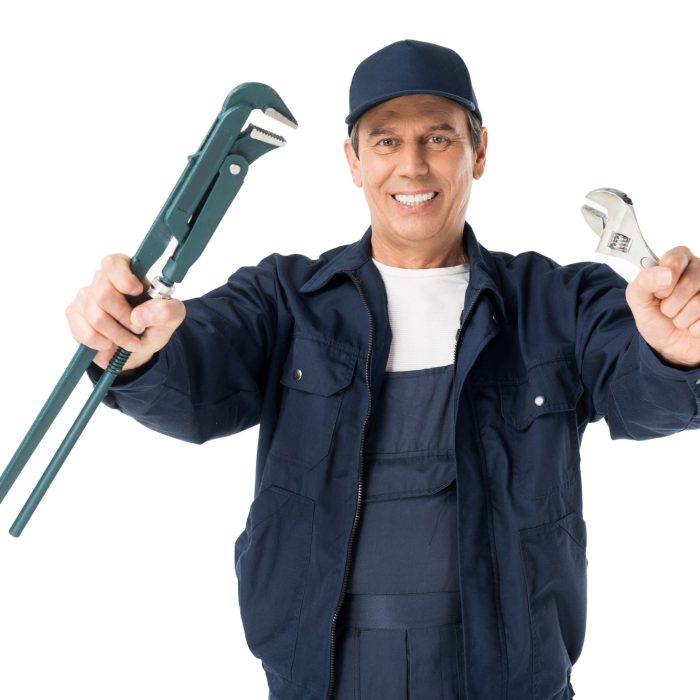 professional-plumber-in-overalls-holding-wrenches-isolated-on-white.jpg
